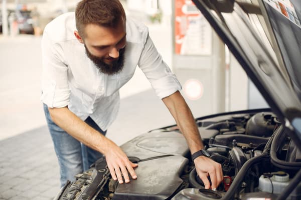handsome-man-checks-engine-his-car.jpg