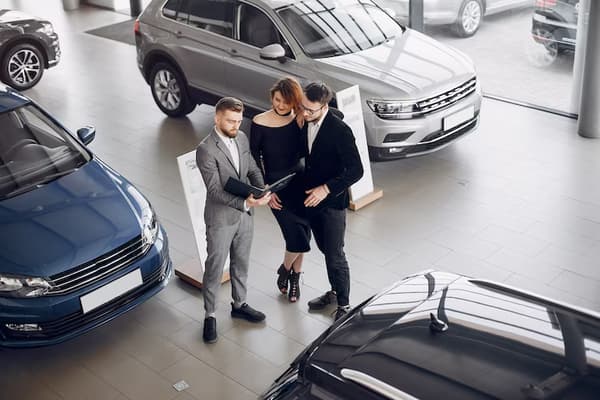 stylish-elegant-couple-car-salon_1157-22680.avif
